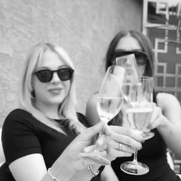Guests raising champagne at a legacy celebration for Argus Properties